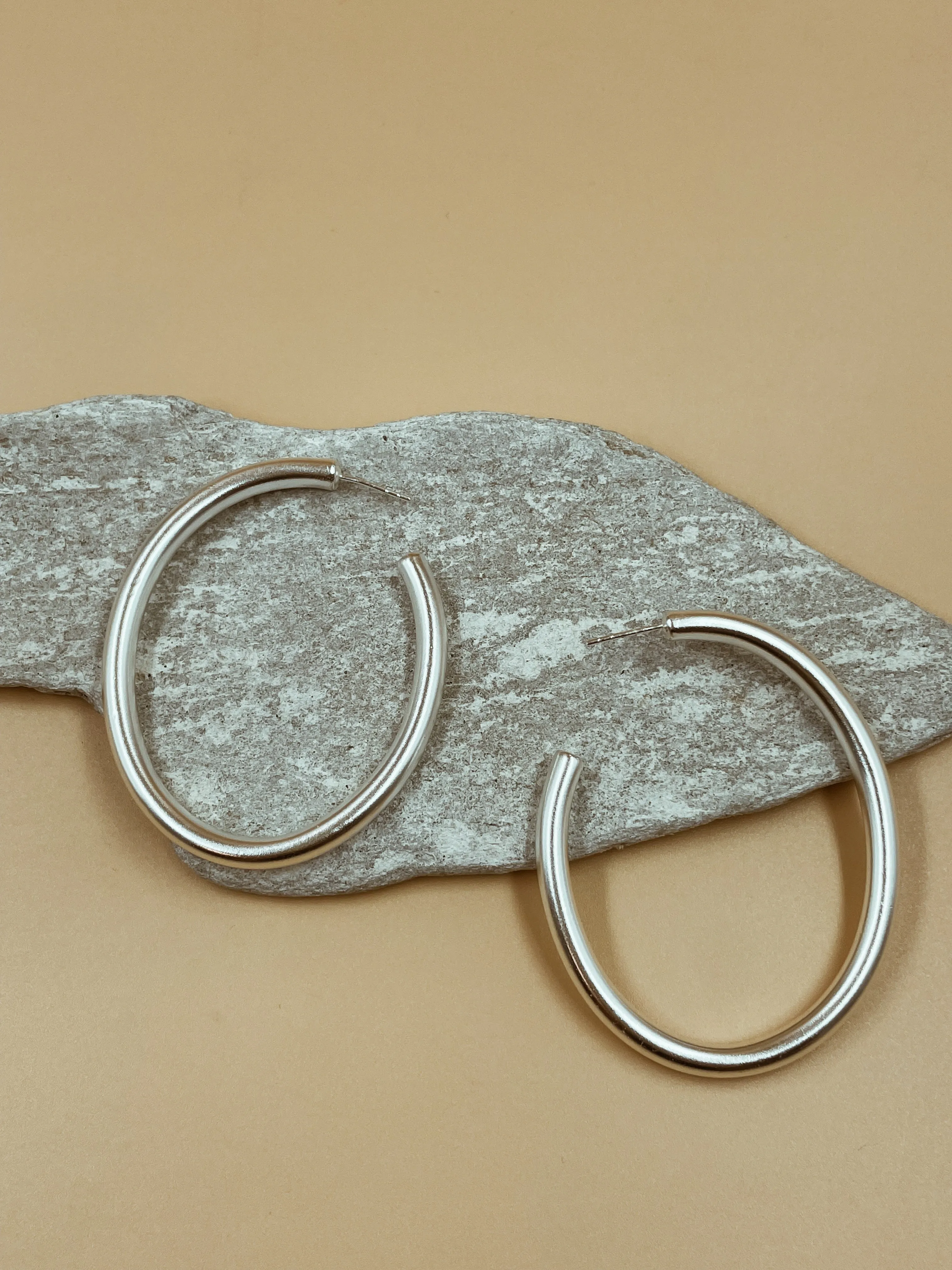 Big Narrow Chimbai Hoops in Silver Tone