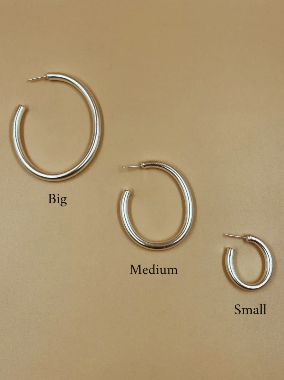 Big Narrow Chimbai Hoops in Silver Tone